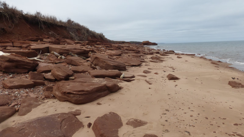 Red sandstone slabs and beach sand, PEI